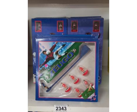 11 Zeugo boxed table football teams (Subbuteo) including Vasco Da Gama, Schalke, Shatar Donetsk etc 