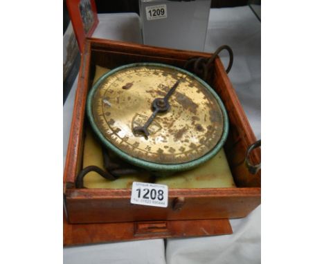 A boxed set of Salter scales 