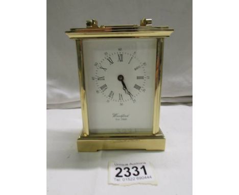 A superb quality heavy brass carriage clock by Woodford, missing key. 