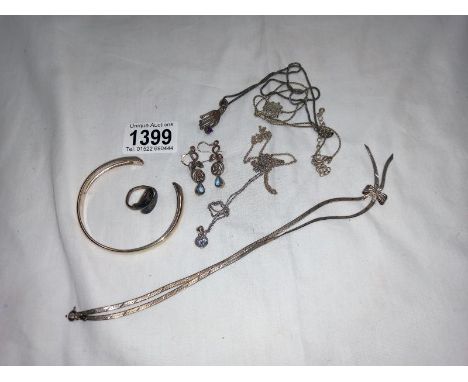 A silver bangle and silver necklaces &amp; rings etc. Silver necklace with silver hand and simulated gemstone. 