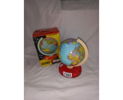 A 1950's metal Chad Valley globe in a box 