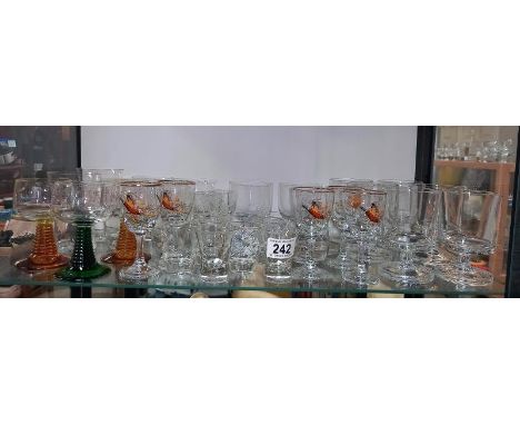 A shelf of drinking glasses