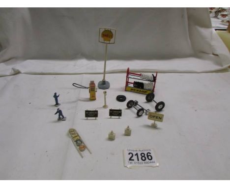 A quantity of Corgi garage forecourt accessories including Dunlop tyre rack. 
