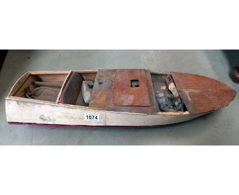 A vintage wooden motor launch with engine 