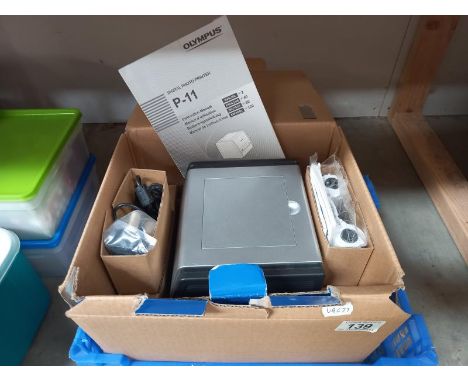 An Olympus digital photo printer model P-11 