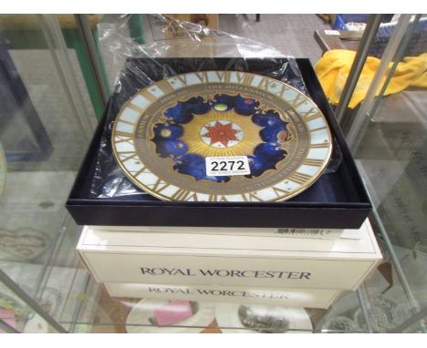 Two Royal Worcester 2000 Millenium Coupe plates and two Royal Worcester 1979 Christmas plates. 