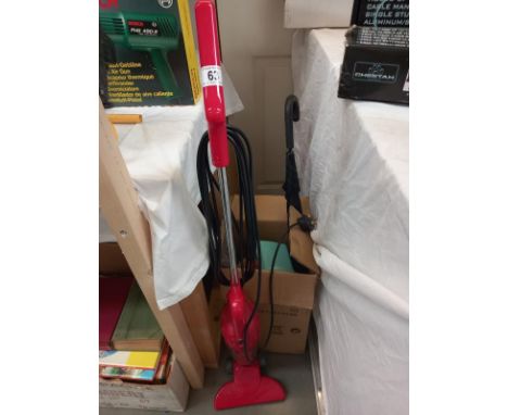 An electric Royale senior vacuum cleaner, a walking stick umbrella and a box of brushes and pans 