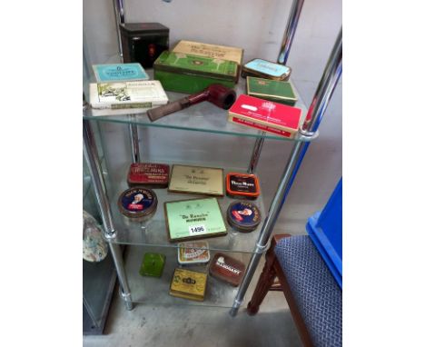 3 shelves of tobacco and cigarette tins 