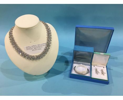 A silver and Diamonique necklace, bangle and matching earrings