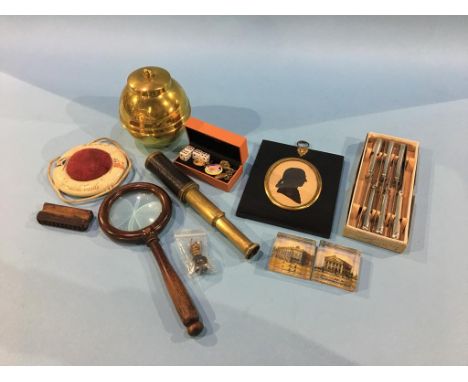 A Silhouette, small telescope, magnifying glass, two glass Harrogate paperweights, a British Empire Exhibition 1924 caddy etc