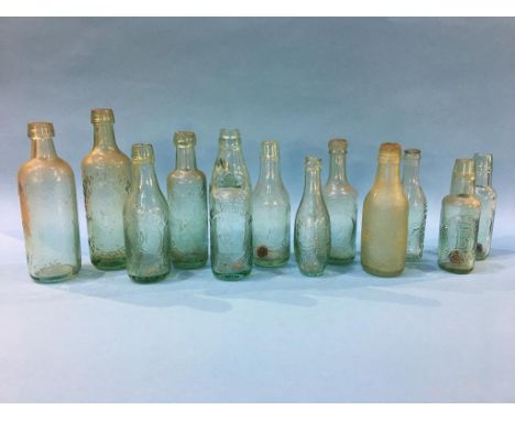 Twelve glass advertising bottles 'Gateshead' to include; Joseph Wilkinson, 3 J. Wilkinson, Wood and Watsons, Kershaw's Limite