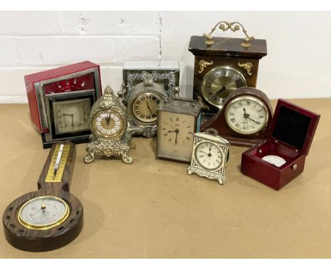 A quantity of vintage mantle clocks and a barometer 