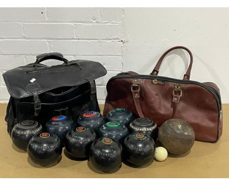 A quantity of vintage boules and 2 bags. 