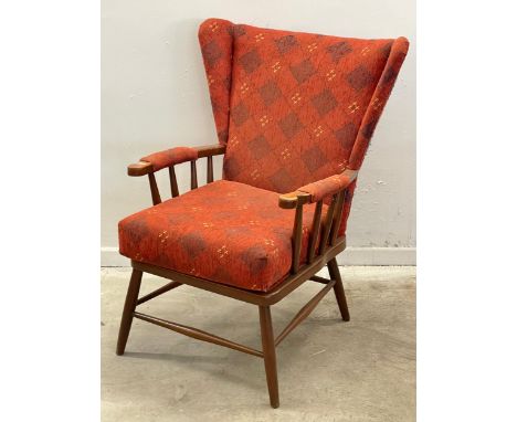 A vintage Ercol style wingback armchair. 