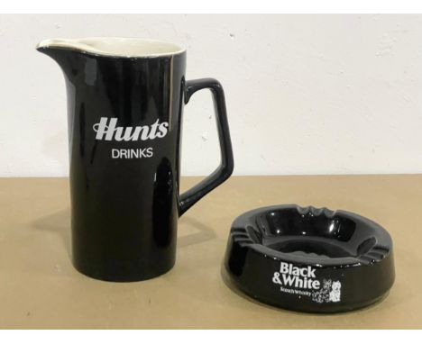 A Black &amp; White Scotch Whisky glass ashtray and a Corona Soft Drinks jug. Both by Wade. 