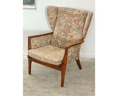 A vintage Parker Knoll wingback armchair. Model 973/4-993/4. 