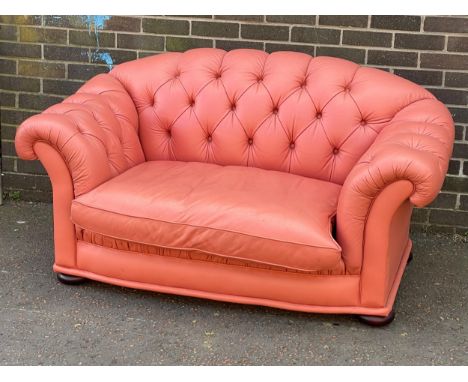 A deep button pink leather 2 seater sofa 157cm 