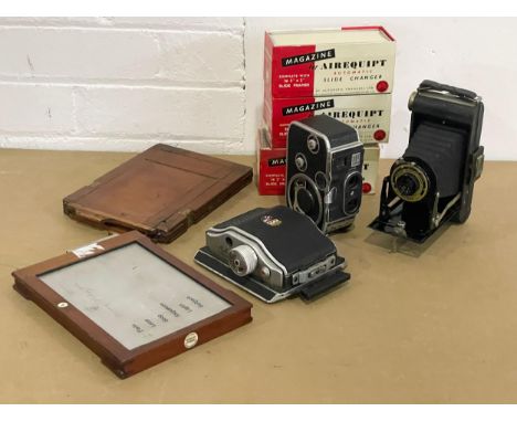 A collection of cameras and accessories. A Paillard Bolex B8. A Linhof Rollex 6x9. A Kodak Folding Brownie etc. 