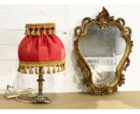 A vintage gilt framed mirror and a brass table lamp. Mirror 33x46cm 