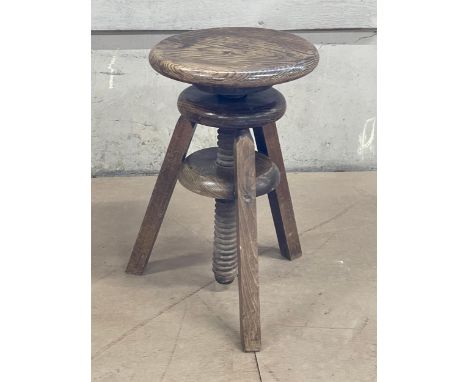 A vintage adjustable artists stool 