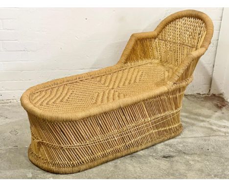A vintage wicker chaise lounge. 55x141cm 