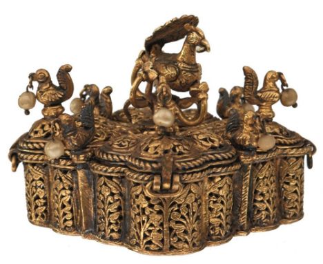 AN 18TH CENTURY INDIAN GOLD PANDAN OR BETEL NUT BOX, of lobed square form and divided in to four lidded compartments with thr