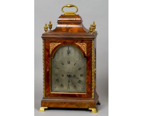 A George III walnut cased eight day repeating bracket clock
The arched silvered dial with strike silent, subsidiary date dial