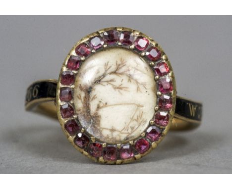 An 18th century unmarked gold and enamel mourning ring
Centred with a scenic view. CONDITION REPORTS: Enamel loss, some missh