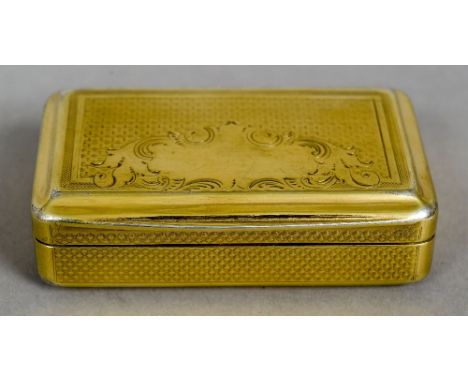 An early 19th century Continental silver gilt snuff box
Of domed rectangular form, the lid with a vacant scrolling cartouche.