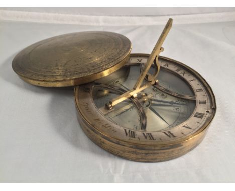 A 19th century lacquered brass cased pocket sundial compass by Spear, Dublin
With folding gnomon and signed silvered hour rin