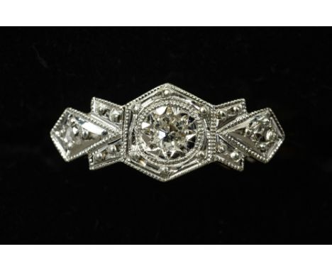 An Art Deco 9 ct gold and platinum three stone diamond ring CONDITION REPORTS: Overall good, some general wear.