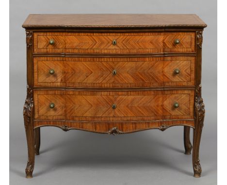 A 19th century Continental satinwood serpentine commode 
The line inlaid beaded top above three drawers with brass handles fl
