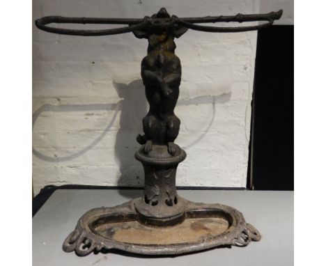 A Victorian cast iron stick stand
Formed as a dog standing on its hind legs holding a riding whip in its mouth.  63 cm high. 