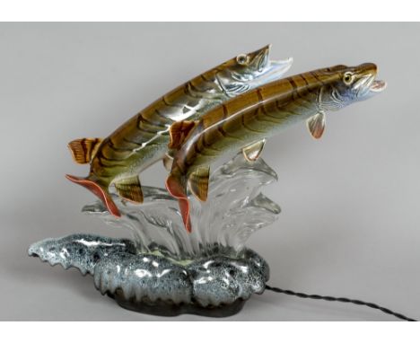 A mid 20th century Continental ceramic and glass table lamp
Surmounted with a pair of pikes.  43 cm high. CONDITION REPORTS: 