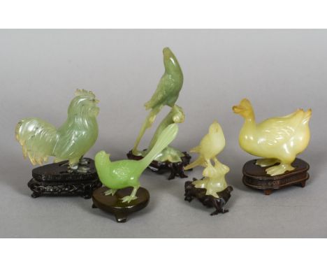 Five various carved jade birds
Each naturalistically modelled and mounted on a carved wooden plinth base.  The largest 15 cm 