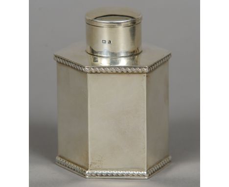 An Edward VII silver tea caddy and cover, hallmarked Birmingham 1908, maker's mark of Henry Williamson Ltd
Of hexagonal secti