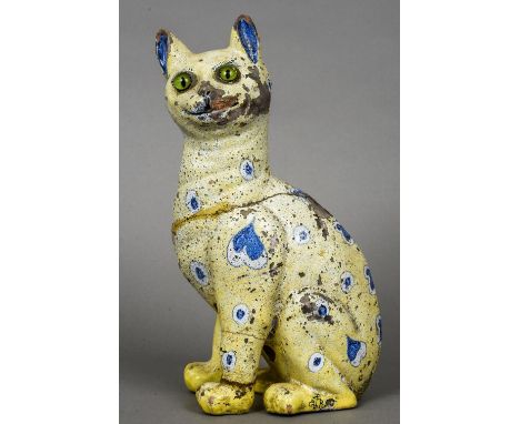 A late 19th century Galle Reinemer faience model of a cat
Typically modelled and decorated in blues on a lemon ground, signed
