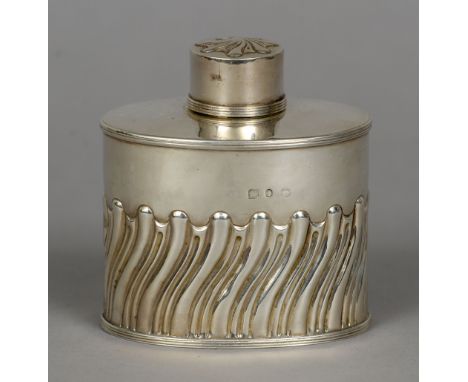 A Victorian silver tea caddy, marks rubbed but probably Birmingham 1893, maker's mark rubbed
Of oval section with part gadroo