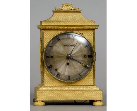 A Continental gilt metal cased quarter striking repeating alarm mantel clock
The signed 4 inch silvered dial with Roman numer