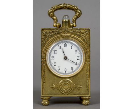 A miniature 935 silver gilt repeating carriage clock
The case with cast foliate decoration, the white enamel dial with Arabic