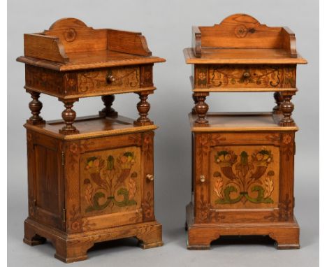 A pair of 19th century Continental poker work decorated pine pot cupboards
Each with a three quarter galleried top above a si