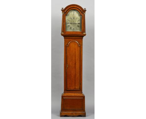 A George III oak cased eight day bell striking longcase clock
The silvered arched 12 inch dial with strike silent, subsidiary