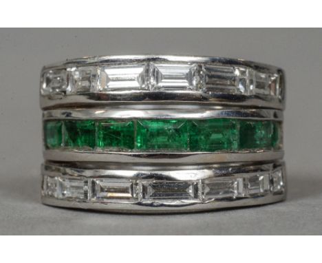 A contemporary 18 ct white gold diamond and emerald ring
Set with twelve baguette cut diamonds and six baguette cut emeralds.