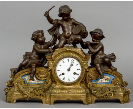 A bronzed art metal Sevres type porcelain inset mantel clock
The 3 1/2 inch white enamel dial with Roman numerals and bell st