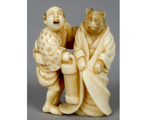 A 19th century Japanese carved ivory netsuke 
Formed as a Samurai and a rat wearing a robe, the reverse signed.   4.5 cm high