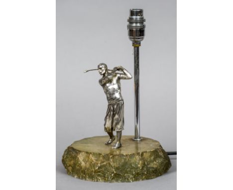 An early 20th century silver plate mounted table lamp 
Formed as a golfer in full swing.  29 cm high. CONDITION REPORTS: Some