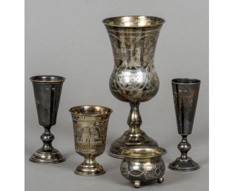 Four various Russian silver cups and a Russian silver salt
The largest 14 cm high.  (5) CONDITION REPORTS: Some tarnishing, s