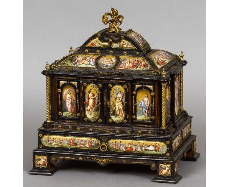 A 19th century ormolu and enamel decorated ebony table cabinet
The domed top surmounted with a putto riding a tortoise above 