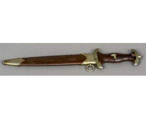 A Nazi SA dagger and scabbard
Of typical form, the blade inscribed ALLES FUR DEUTCHLAND.  36 cm long. CONDITION REPORTS: Some