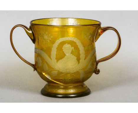 A large cut amber overlaid glass commemorative loving cup
Decorated with thistles and a portrait of Bonnie Prince Charlie and